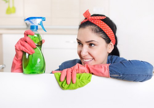 Professional carpet cleaning team completing work with safety awareness
