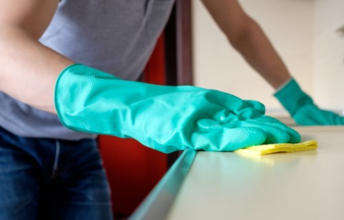 Cleaner vacuuming fine dust from floors during after builders cleaning in Maidavale